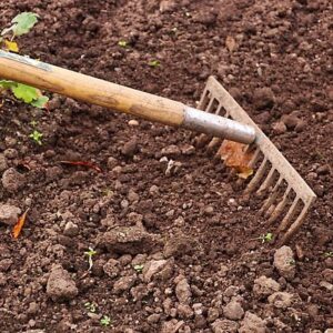 Soil conditioner being mixed with topsoil